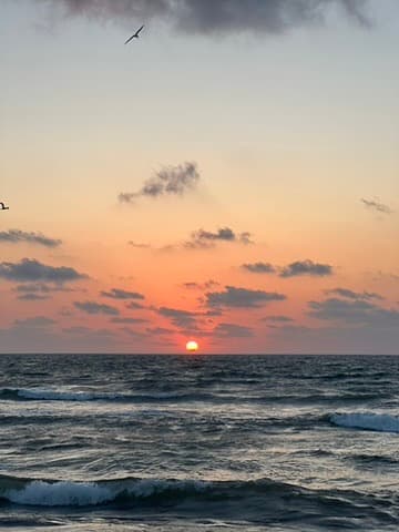 Sunset over the ocean in Tulum