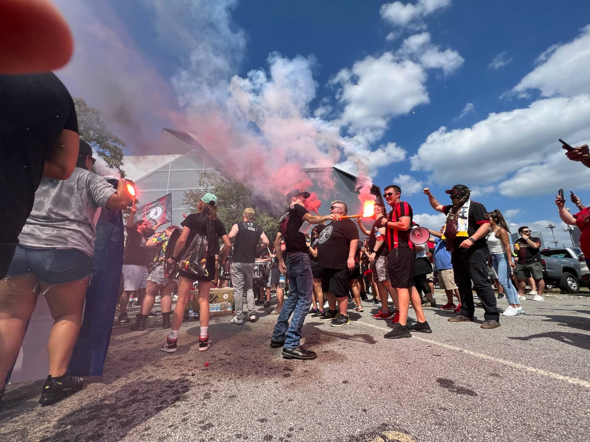 Fans with flares outside the stadium before an Atlanta United match